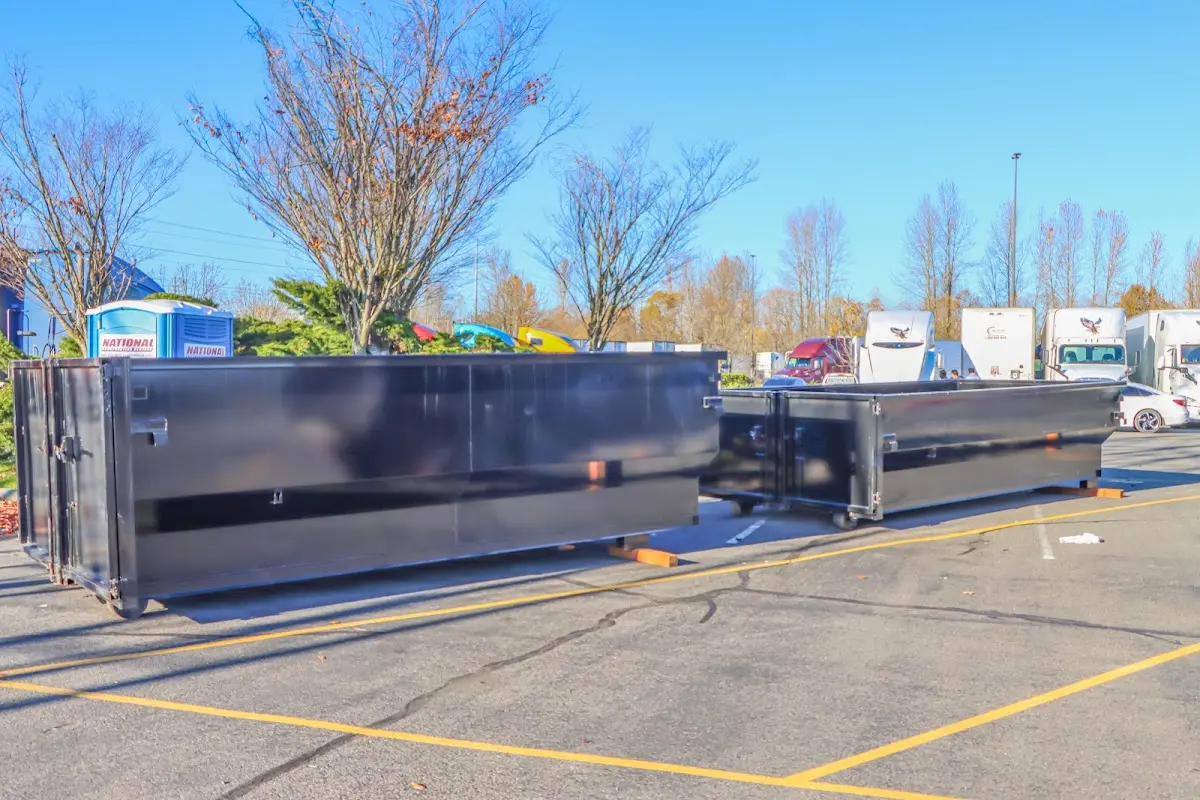 Professional dumpster rental service with roll-off container on residential driveway in Macedonia